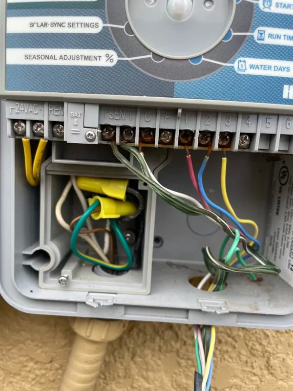 Zone wires connected inside a sprinkler controller